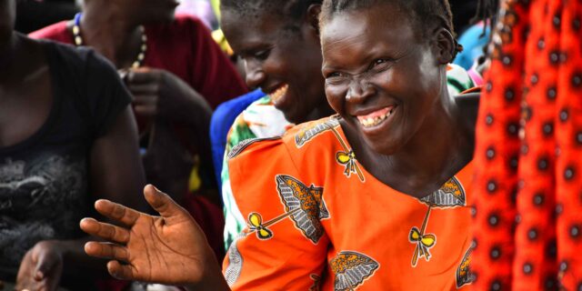 wgef-woman-smiling-hand-out