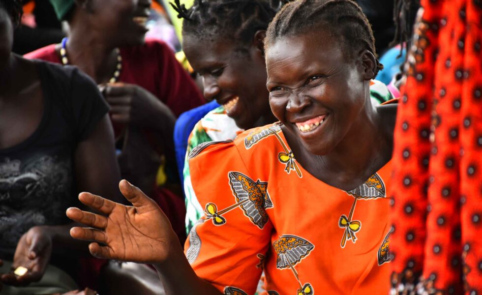 wgef-woman-smiling-hand-out