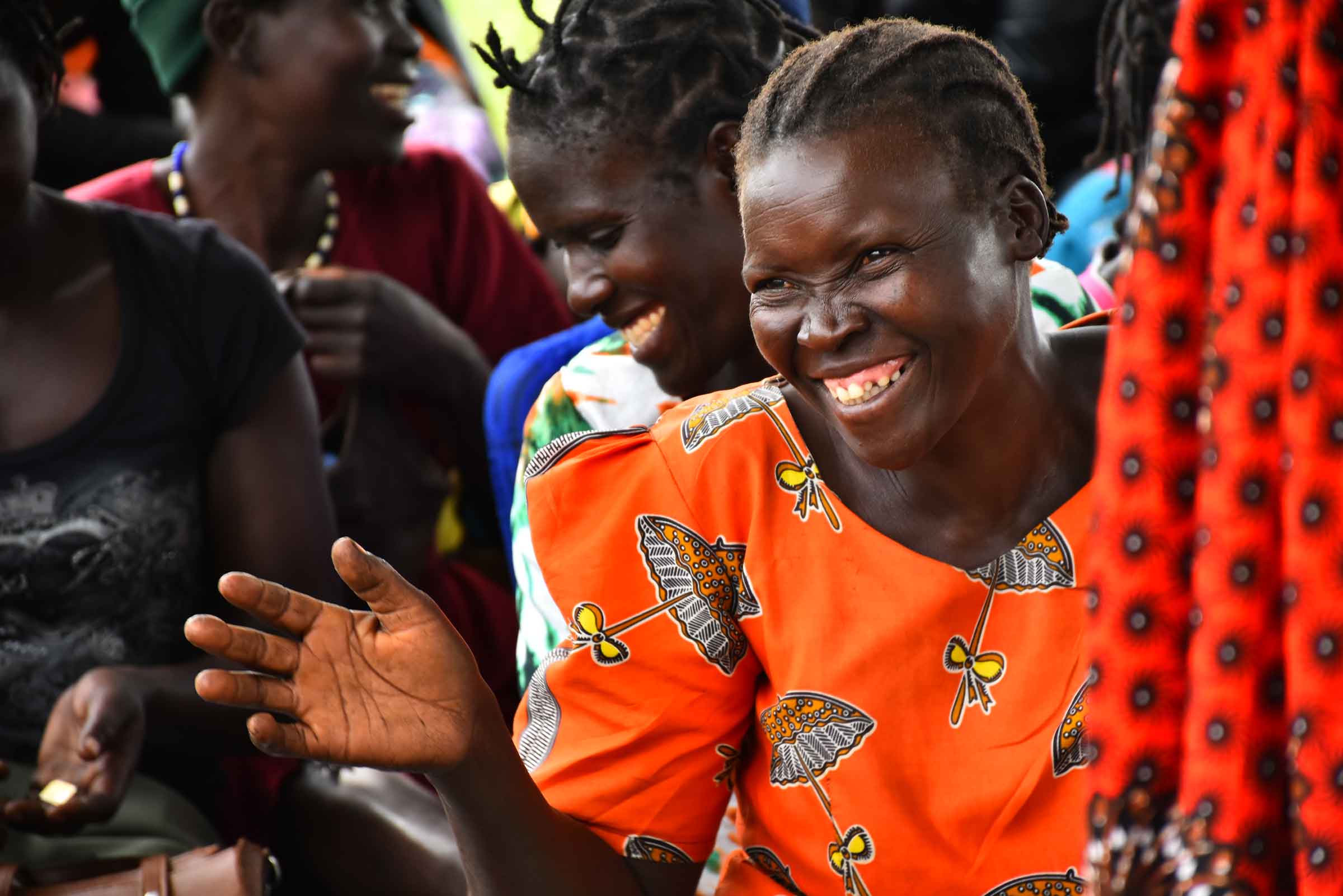 wgef-woman-smiling-hand-out