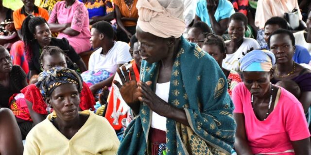 woman speaking at political gathering