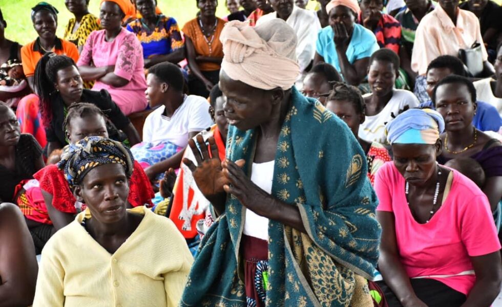 woman speaking at political gathering